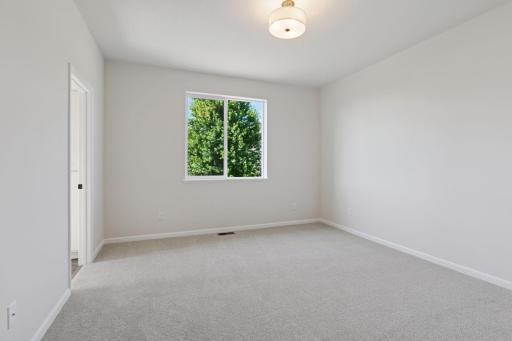 Photo is of a completed Carlton home with same selections and exterior. Some interior items may differ.