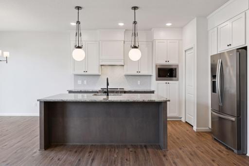 Photo is of a completed Carlton home with same selections and exterior. Some interior items may differ.