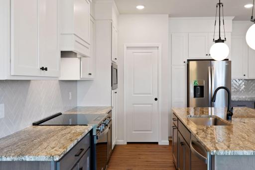 Photo is of a completed Carlton home with same selections and exterior. Some interior items may differ.