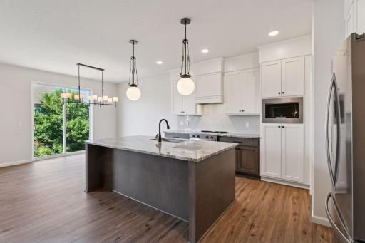 Photo is of a completed Carlton home with same selections and exterior. Some interior items may differ.