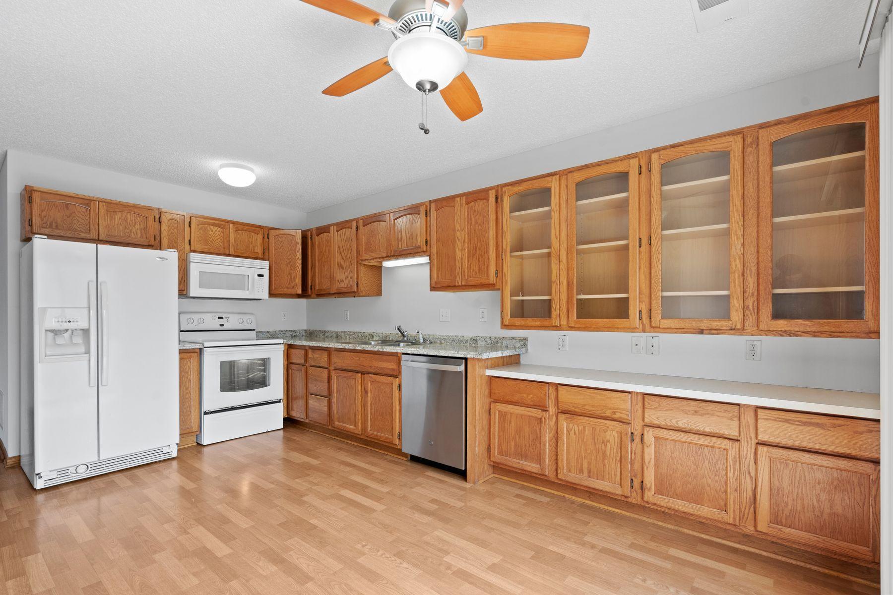 Tons of counter and cabinet space with beautiful wood cabinets