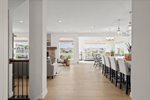 Foyer hallway opens into an expansive main level with seamless flow through the kitchen, dining, and living space. *Photo of a Beckett model home - design options may vary.
