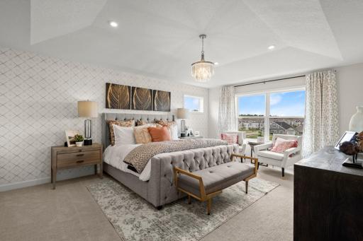 Owner's suite retreat with generous layout and space for a sitting area - designed for restful nights and relaxation *Photo of a Beckett model home - design options may vary.