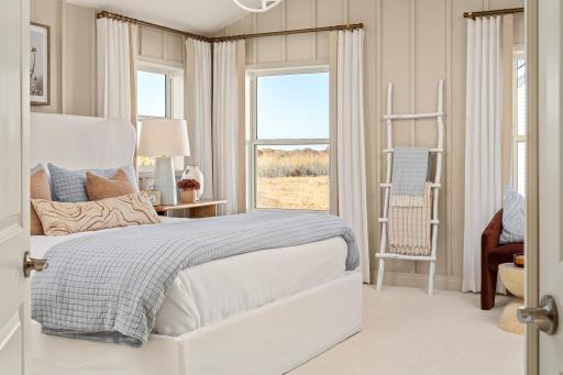 Wake up slow in this owner's suite with soft light, warm tones, and a calm feel that makes every morning better *photo of model home (design options may vary)