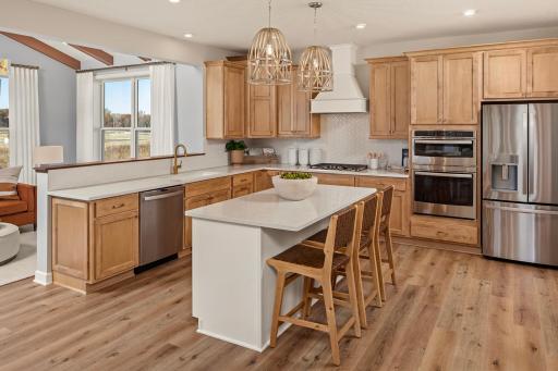 This is a kitchen that instantly draws you in, with a great island and space to cook, chat, and hang out *photo of model home (design options may vary)
