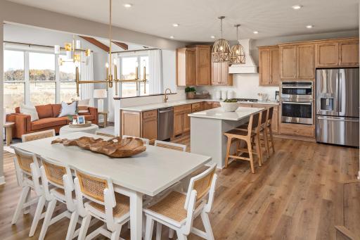 Take a seat and stay awhile, this dining space flows right into the kitchen, making every meal feels easy and connected *photo of model home (design options may vary)