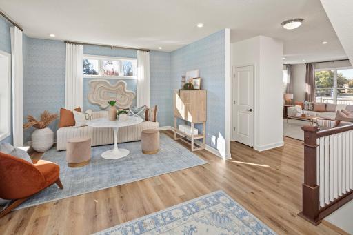 Light, open , and full of possibility - this front space brings energy the second you walk through the door *photo of model home (design options may vary)