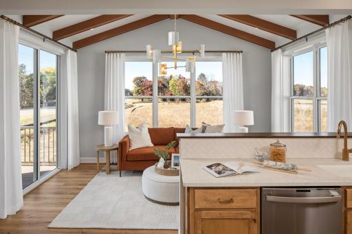 Sunlight steals the show here - your go-to spot for slowing mornings, coffee refills, and soaking in the view *photo of model home (design options may vary)