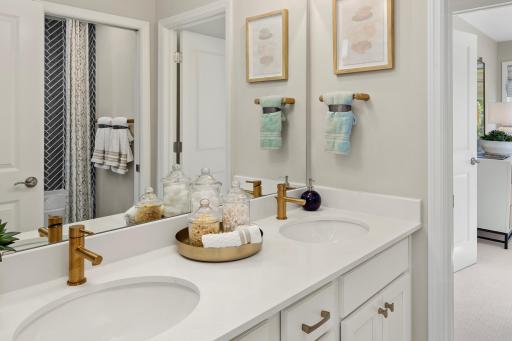 With two sinks and a sharp, modern look, this bathroom keeps things organized and ready to handle the daily routine *photo of model home (design options may vary)