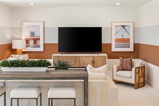 Kick back in a lower level designed for comfort, with the perfect setup for streaming, lounging, and relaxing your way *photo of model home (design options may vary)