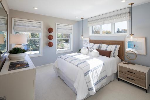 Light filled and cheerful, this bedroom offers a crisp style and a layout that makes everyday feel simple *photo of model home (design options may vary)