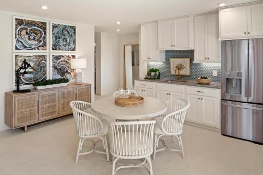 Gather, snack, or sip - this lower level adds a bonus hangout with space to dine, relax, and enjoy the moment *photo of model home (design options may vary)