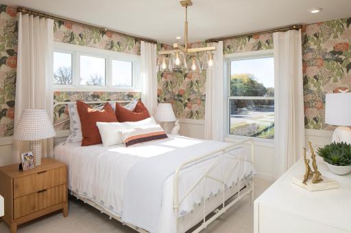 Bright and full of personality, this bedroom pops with fun details a cozy layout that feels cheerful and inviting *photo of model home (design options may vary)