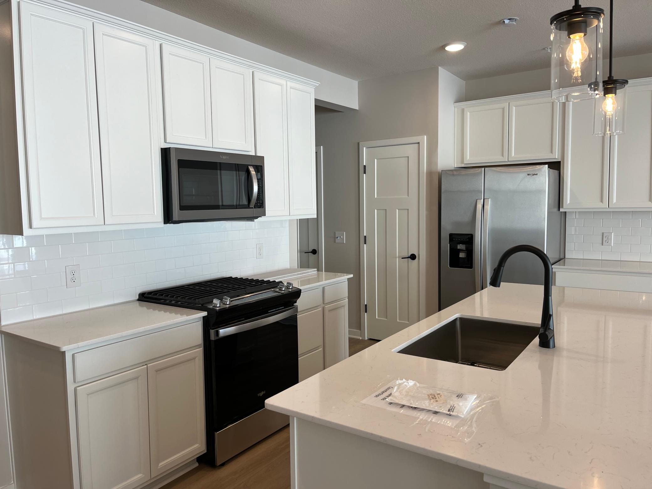 Gas range and brand-new refridgerator