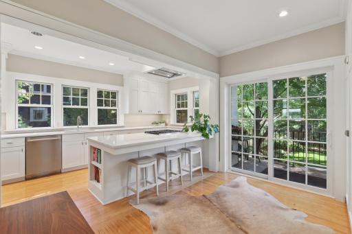 View of the patio doors from the kitchen - ideal location for dining al fresco with guests, entertaining or just running in and out of the stunning backyard.