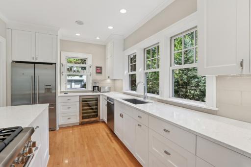 Ample quartz countertops, beverage fridge and tons of storage for all your gadgets