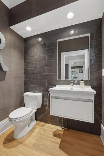 Main floor powder room with beautiful fixtures and tile work.