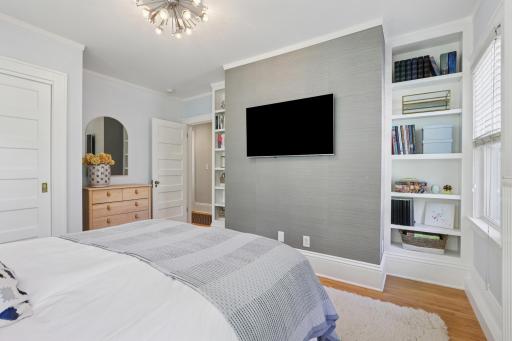 Guest bedroom with built-in shelving and lots of space
