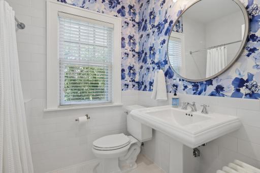 Full guest bath on upper level, beautifully updated and also with heated tile floors.