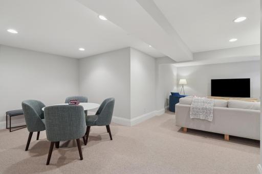 Family room with updated carpet, lighting, and bonus seating nook for music, entertainment, exercise.