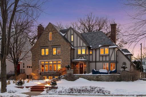 Golden hour glow over this iconic Lake of the Isles residence