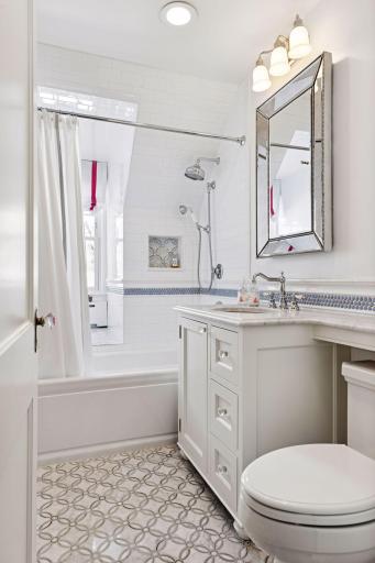 One of three bedrooms featuring a private en suite bath