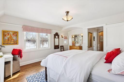 Bright and inviting, this east-facing fourth bedroom offers a peaceful retreat with a charming nook for work or study.