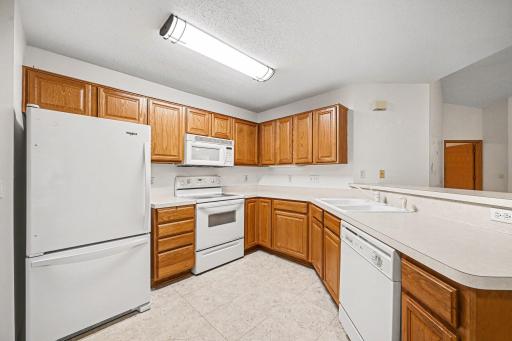 Open easy kitchen with a fridge new in 2023