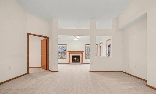 Bright, cheery sunroom with a gas burning fireplace and lots of windows.jpeg