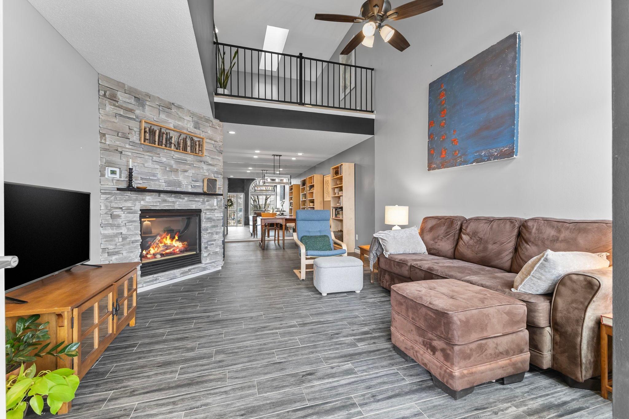 Upon entry, note the dramatic two-story family room and gas fireplace with floor-to-ceiling surround!