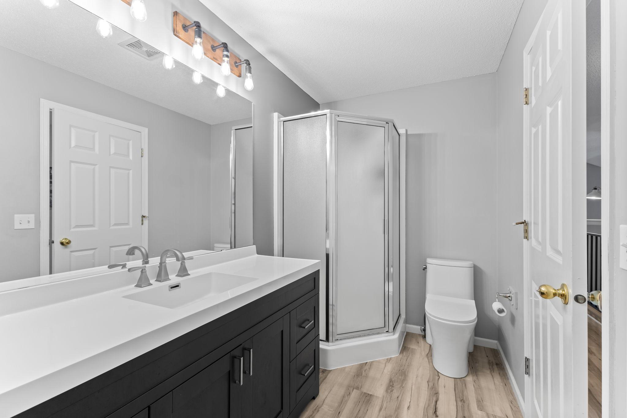 As a bonus, this bathroom features a separate bathtub and shower!