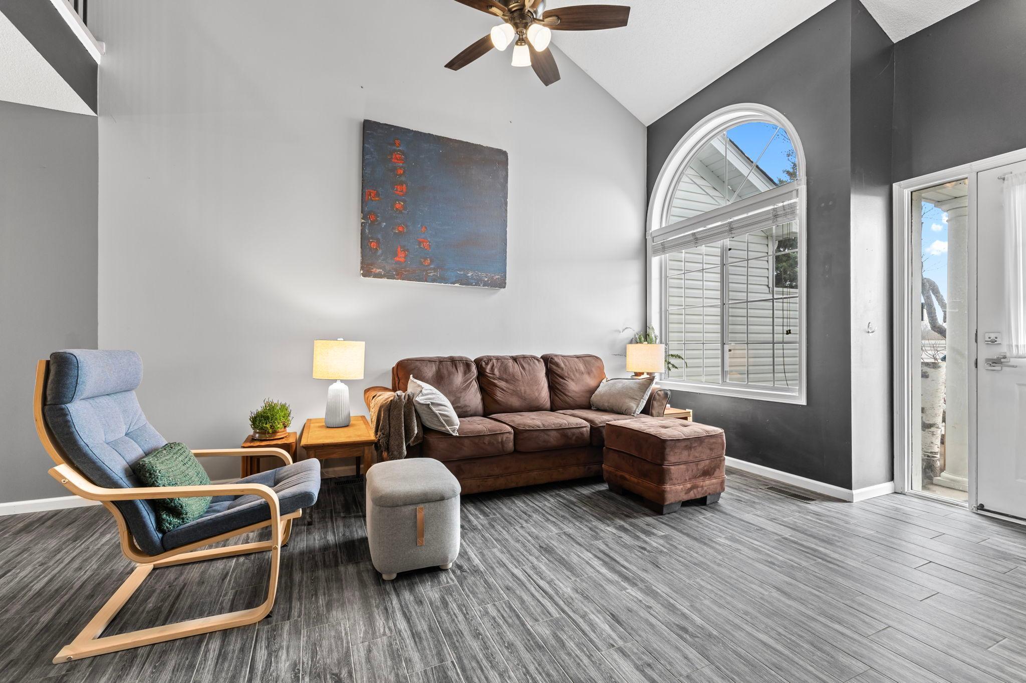 The front window lets in an abundance of natural light with a private patio directly outside.