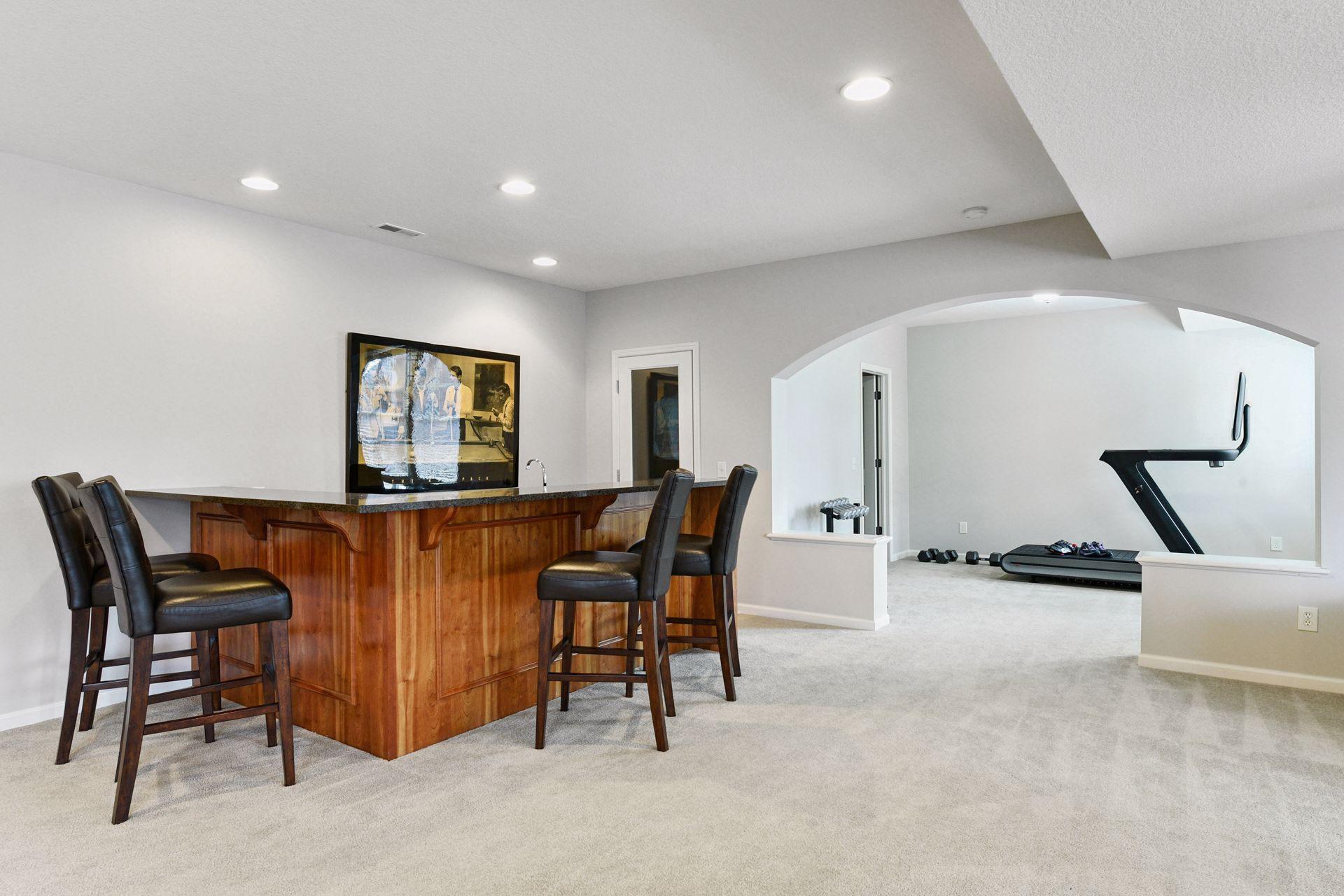 Bar and storage room and bonus work out room with closet.