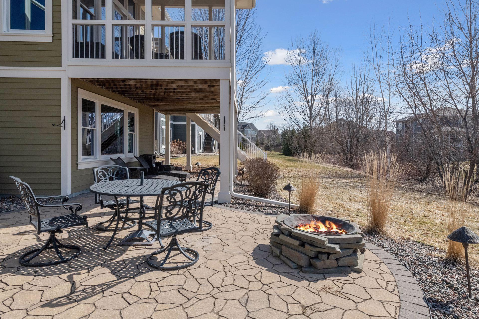 Private back patio with fireplace yet lots of play area too