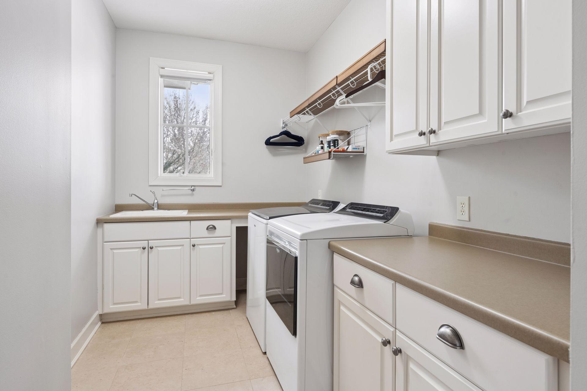 Main floor laundry next to primary suite