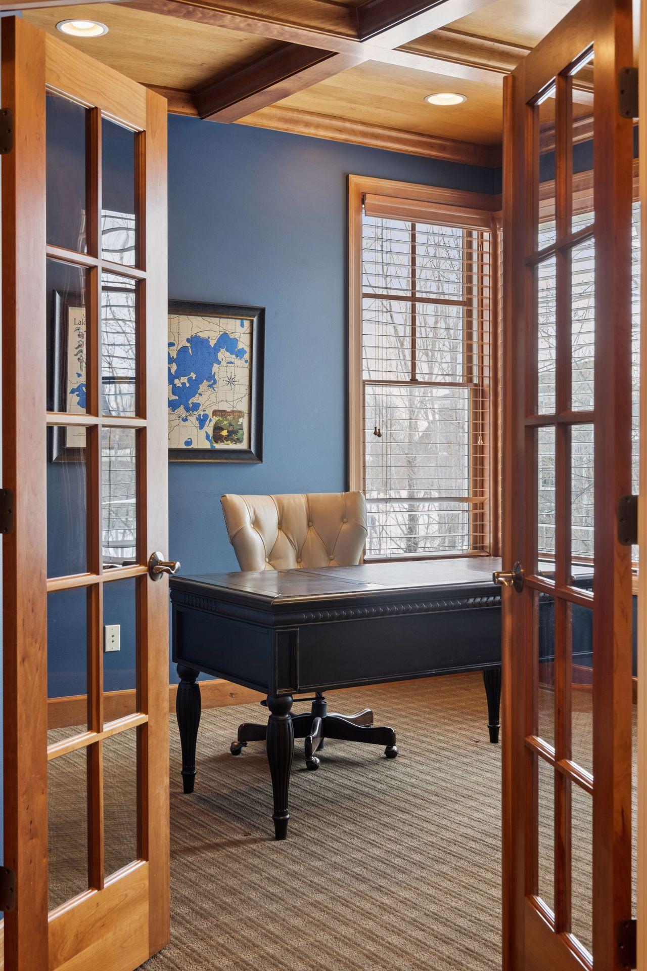 Glass french doors lead to office