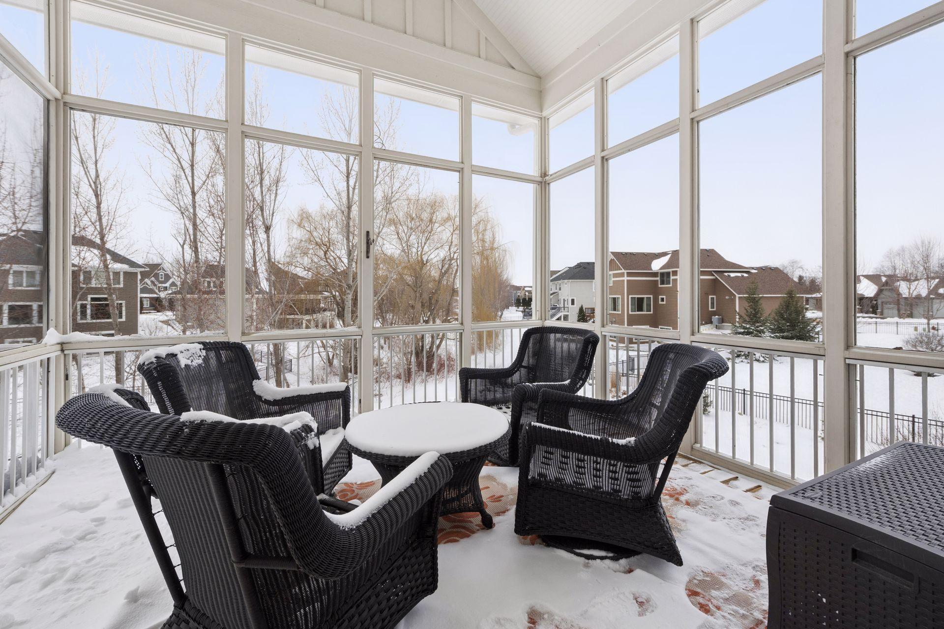 Screened porch overlooks pond