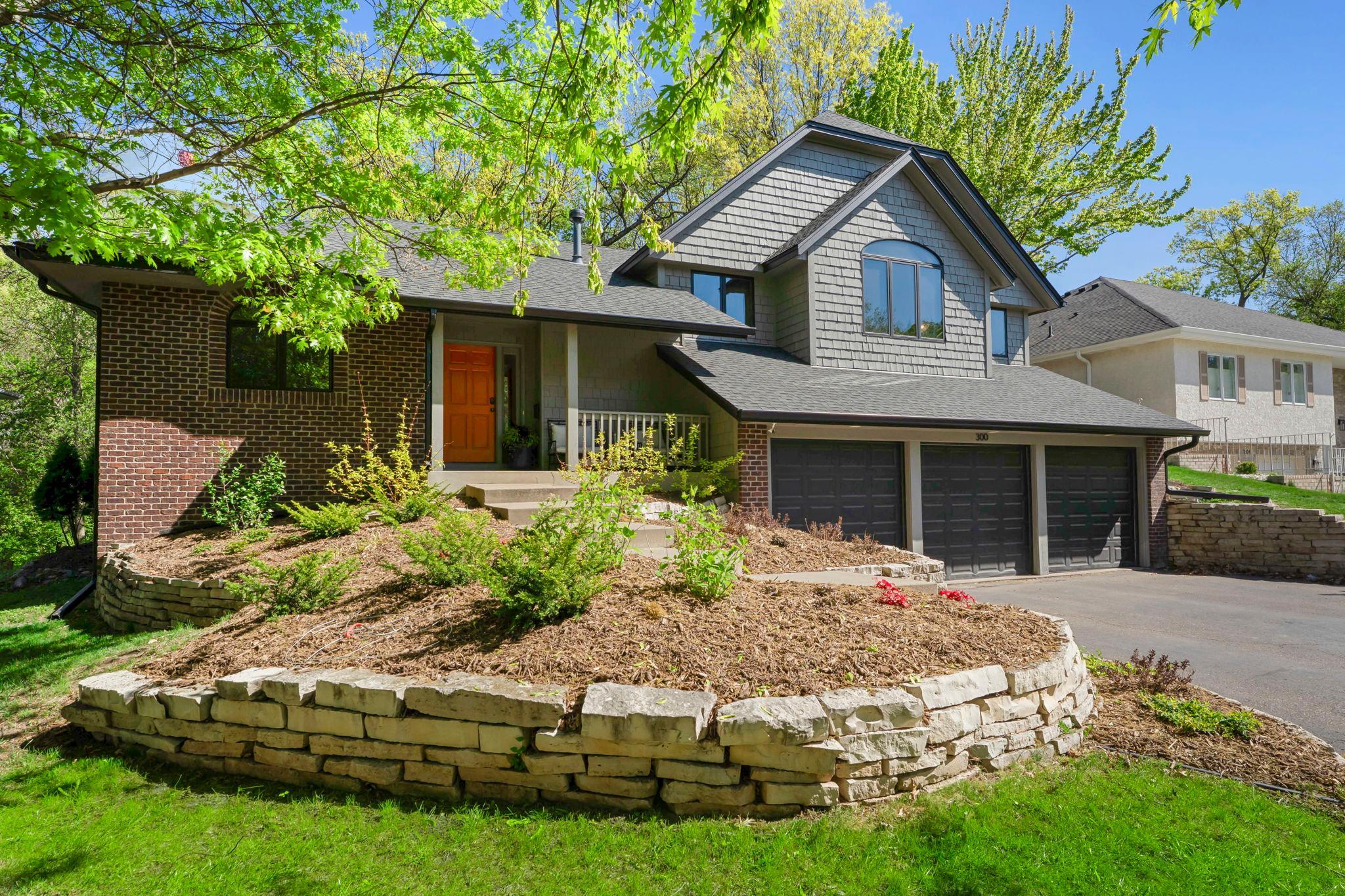 Welcome to 300 Dearborn Ct Edina. Tucked away on a quiet double cul-de-sac on a wooded lot.