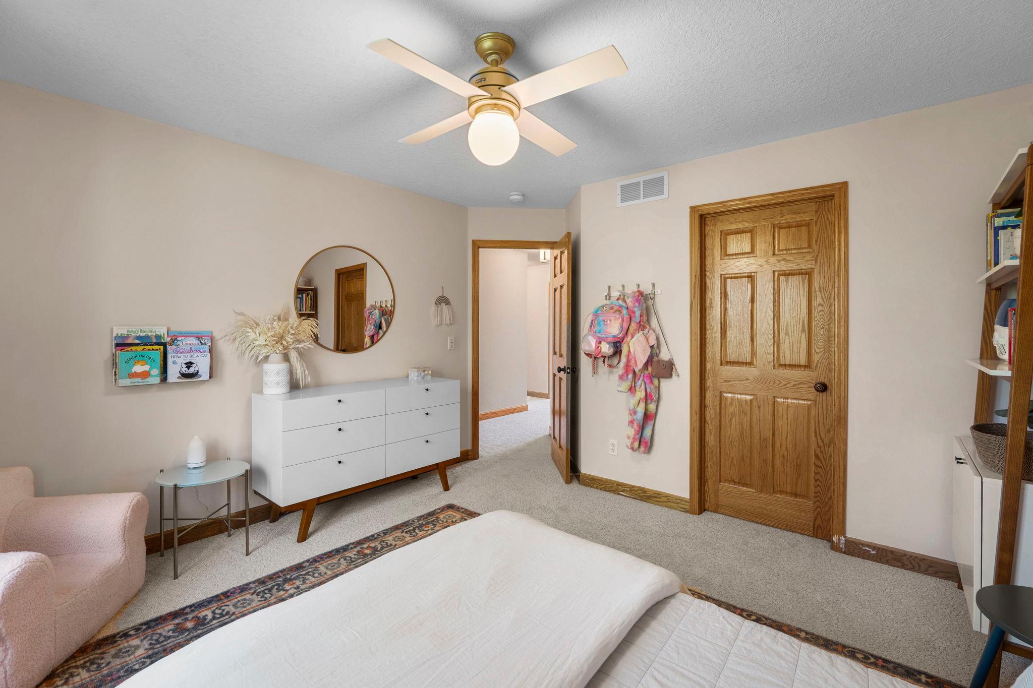 Another of the 3 bedrooms up, featuring a window on the woods and walk in closet.
