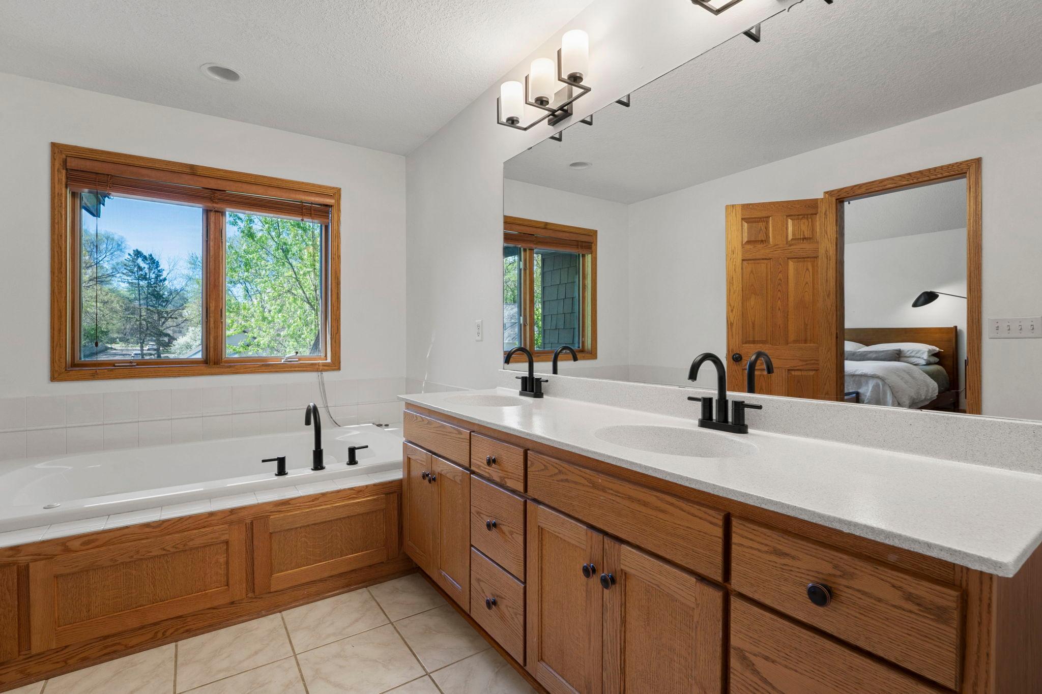 Primary en-suite have double lavatory and separate shower and tub and new lighting