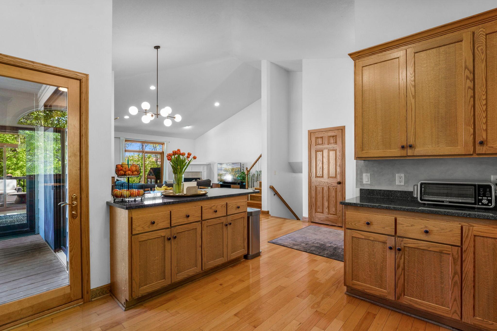 Balcony access from kitchen. Quality, hardwoods and solid wood paneled doors and trim throughout.