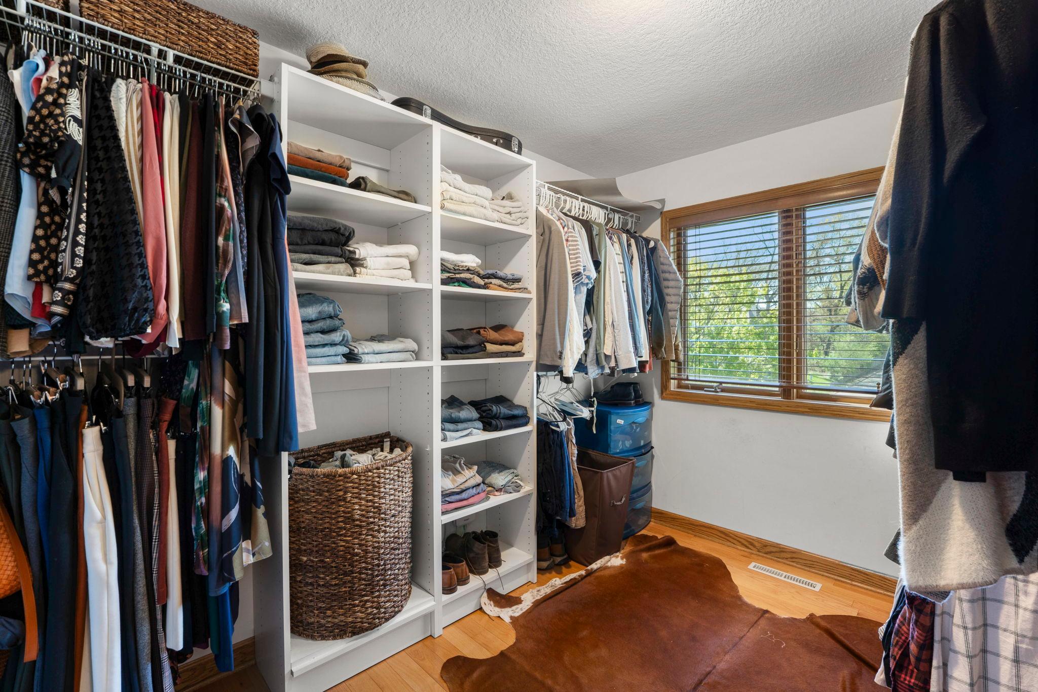 Huge walk in for the primary suite features great natural light