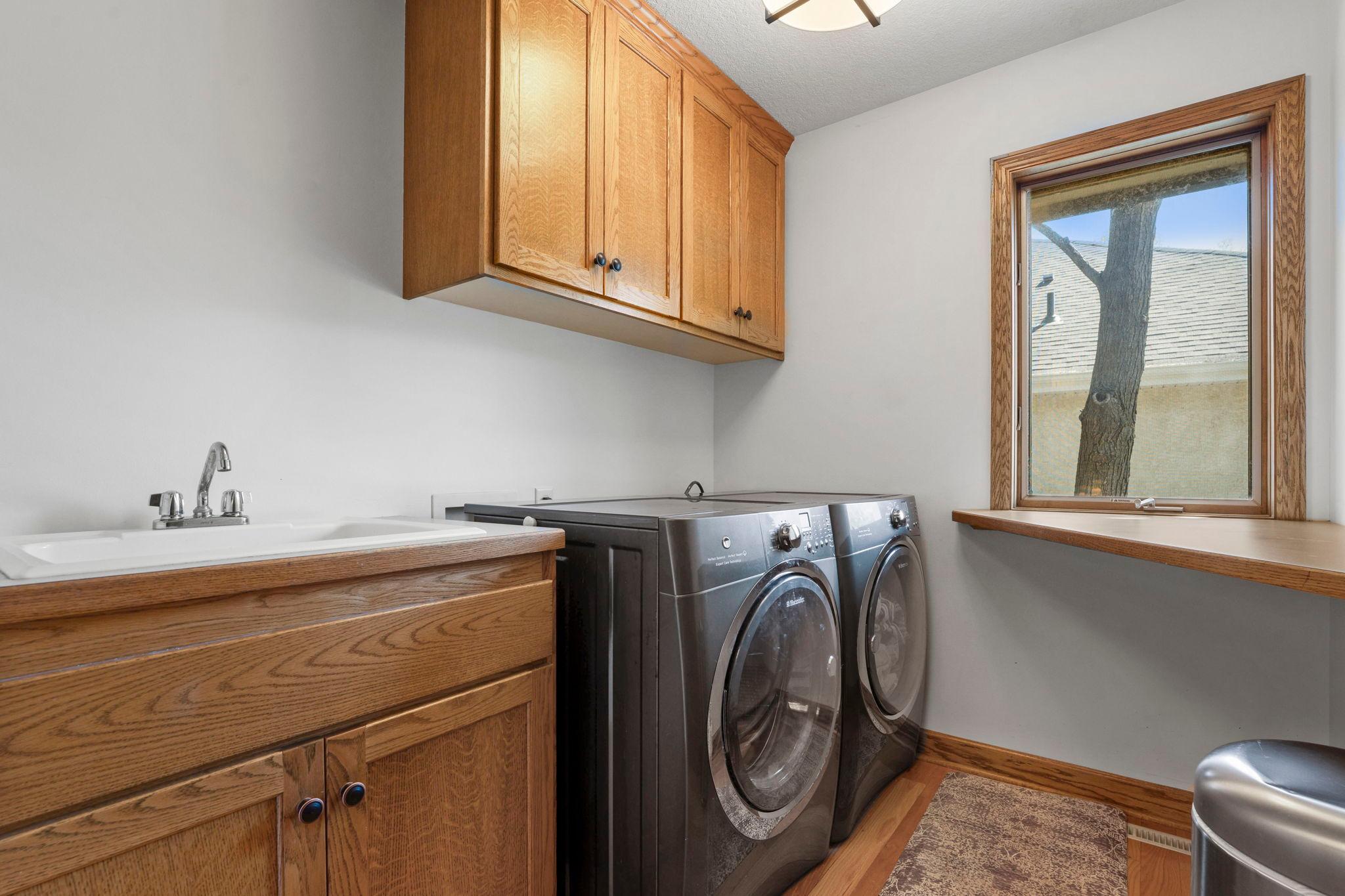 Laundry room on the upper floor, with added storage space.