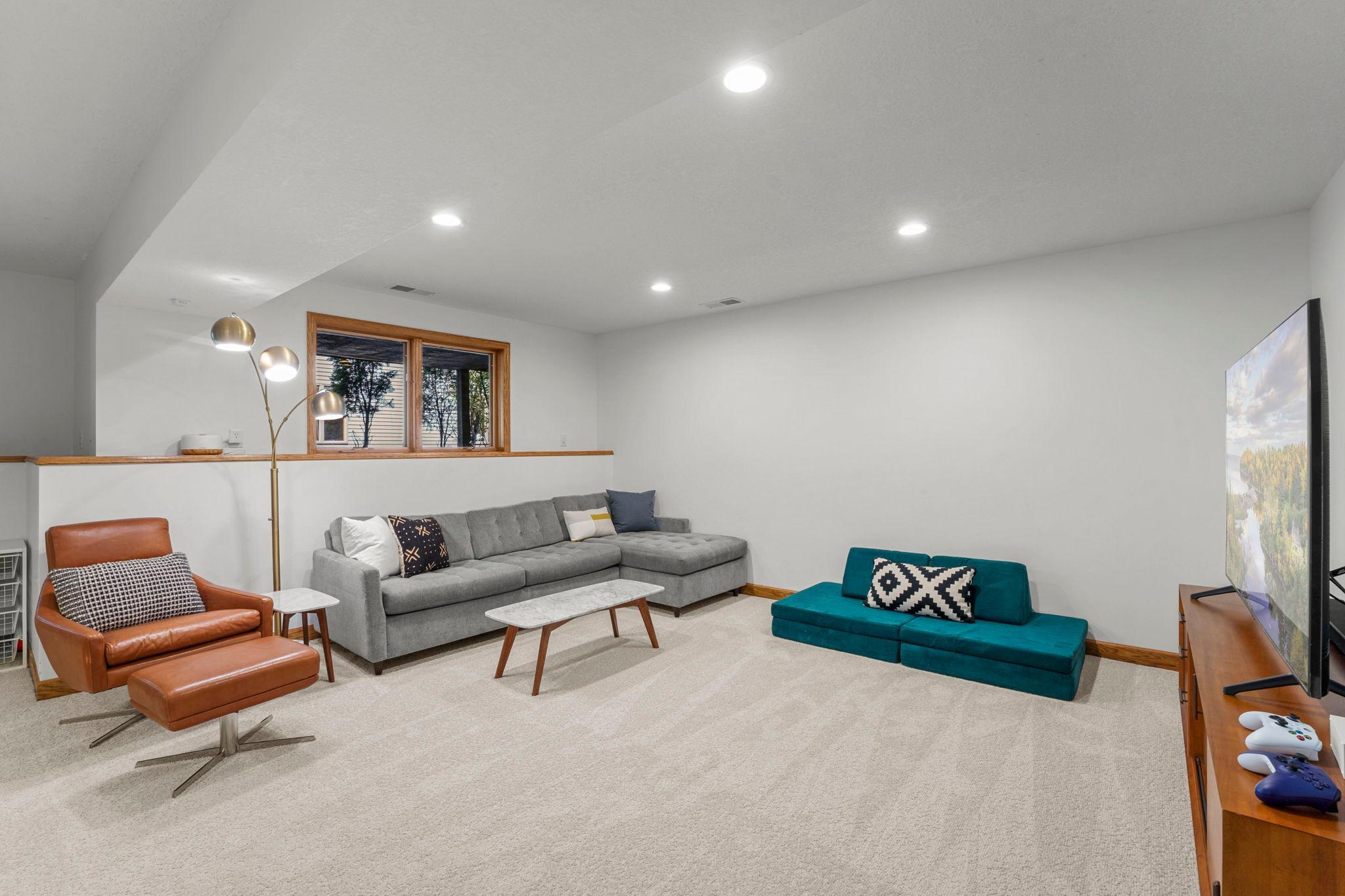 Large, family room has new carpet and tons of light from large windows, even on the lowest level.