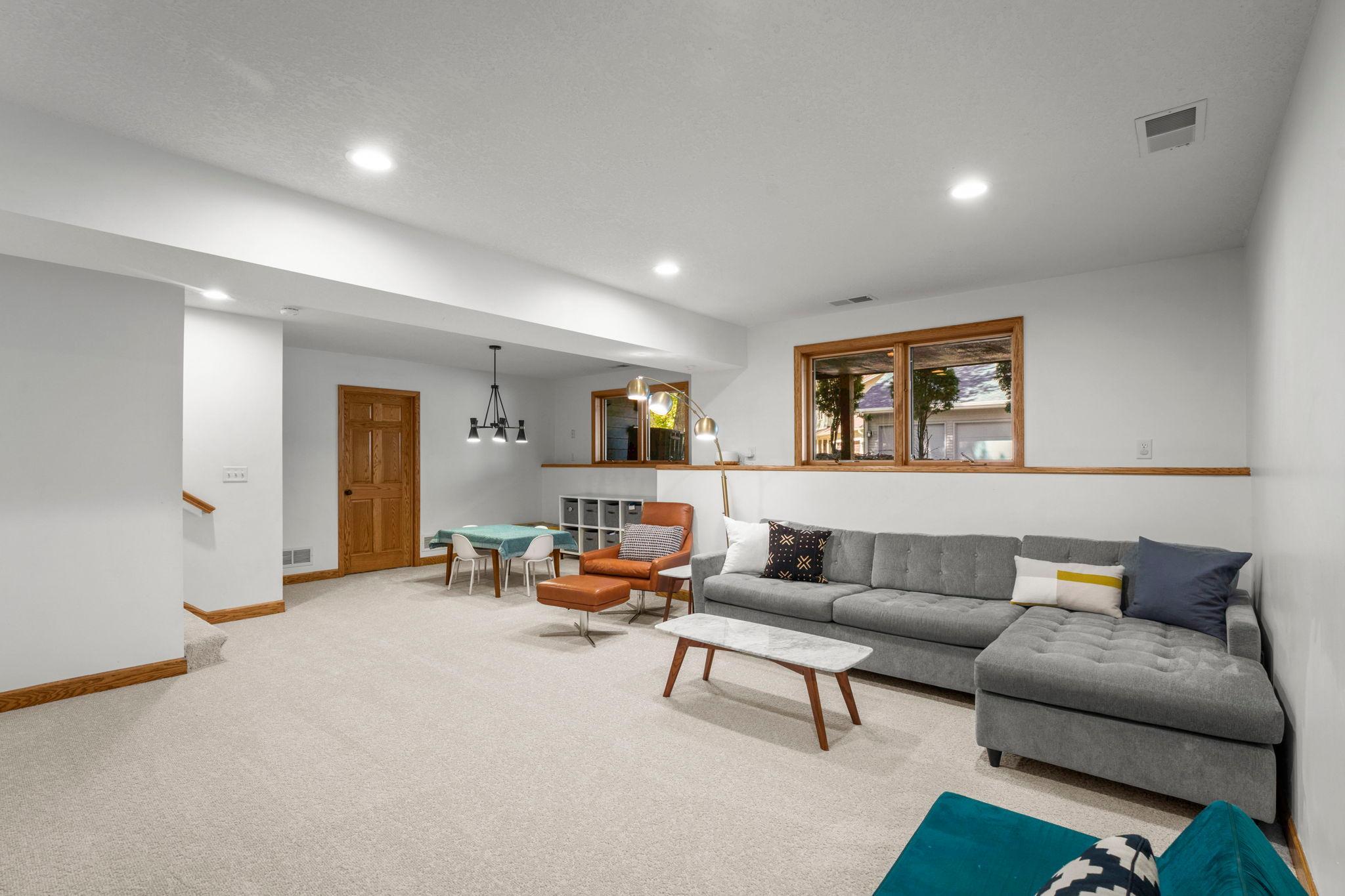 Large, family room has new carpet and tons of light from large windows, even on the lowest level.