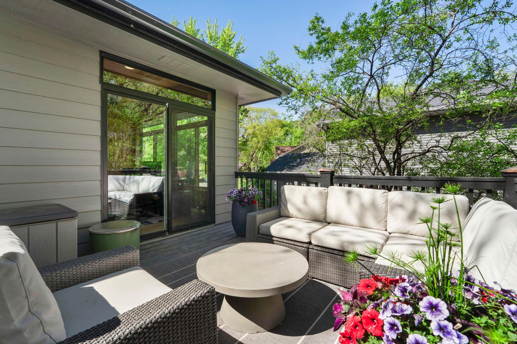 Deck off the main floor living area, perched on the hillside in the trees is an enchanting, private getaway...or gathering space.