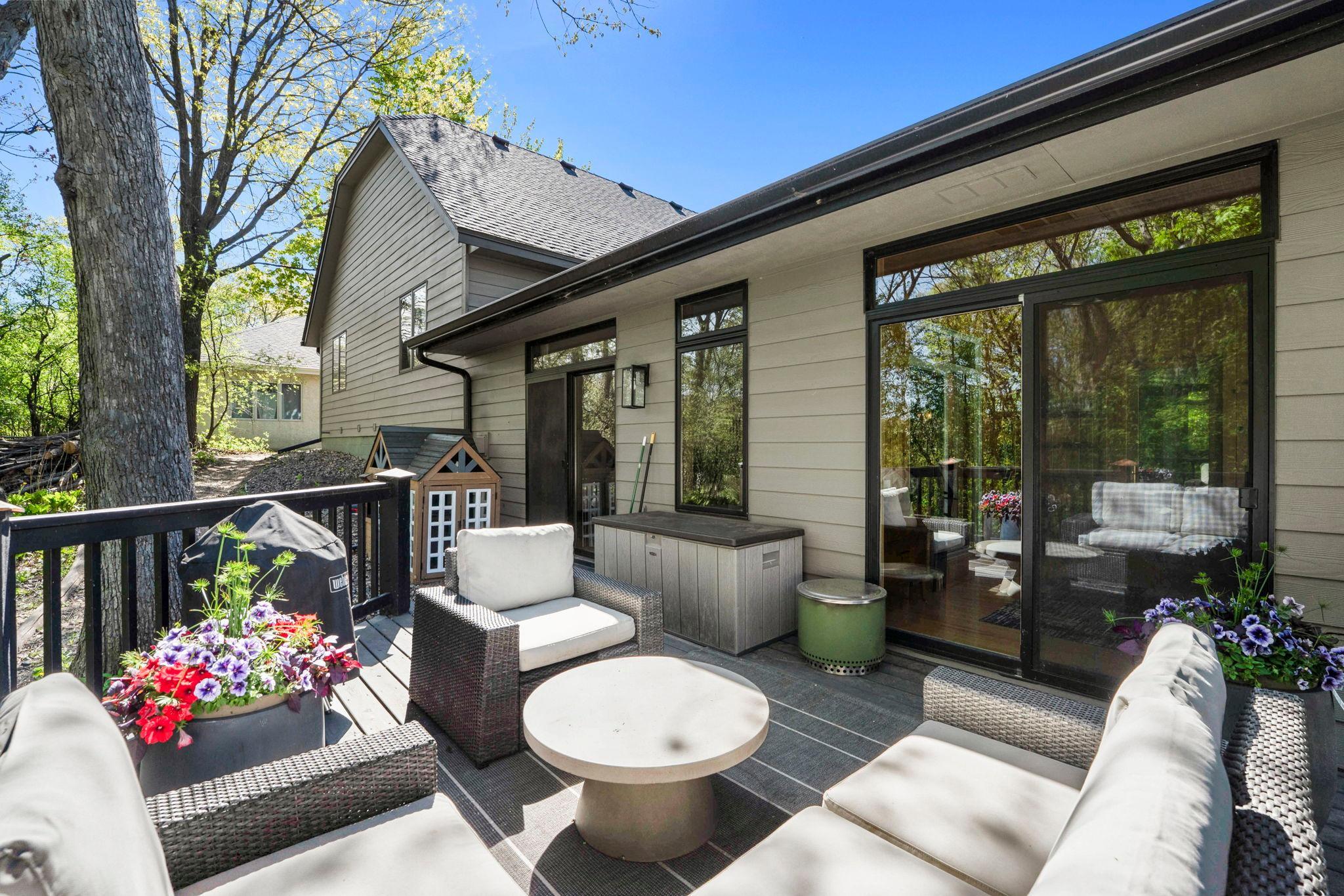 Deck off the main floor living area, perched on the hillside in the trees is an enchanting, private getaway...or gathering space.