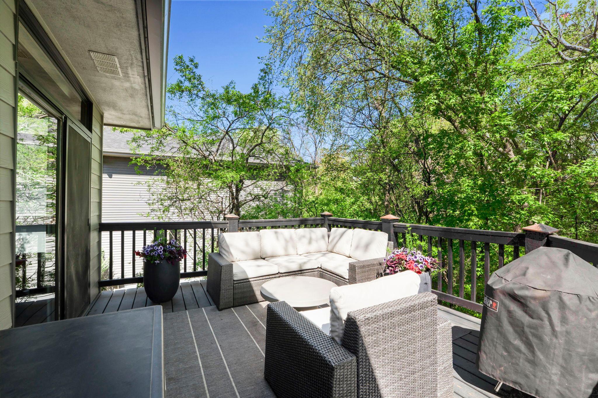 Deck off the main floor living area, perched on the hillside in the trees is an enchanting, private getaway...or gathering space.