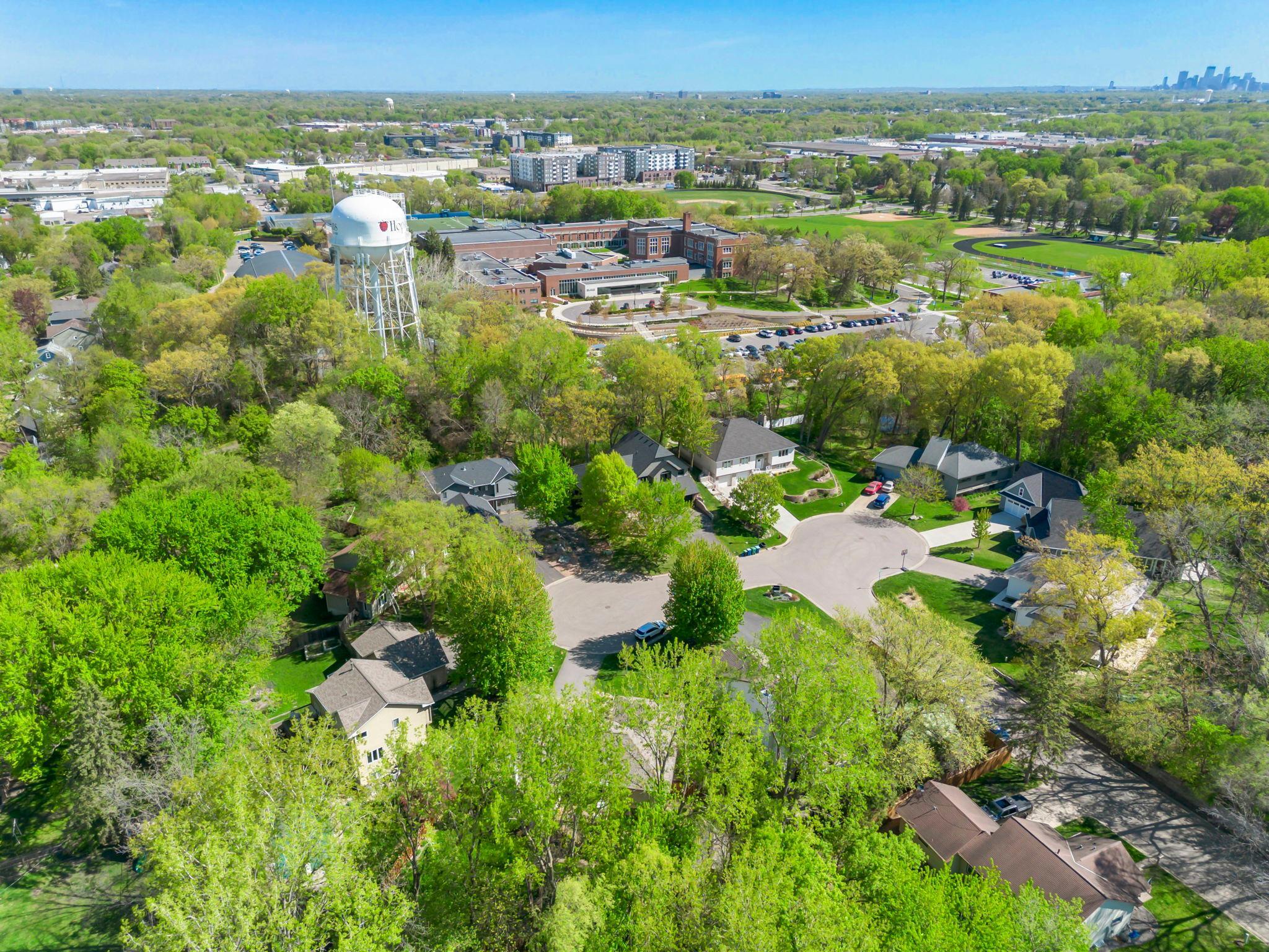 Attractive, hidden away cul de sac, wooded lots and trails behind. Blake school just behind. Such a great location!