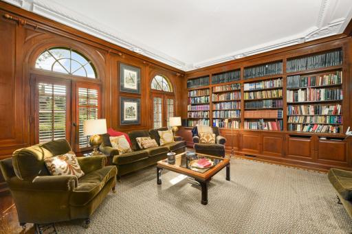 Library built-in bookshelves and a gas fireplace.